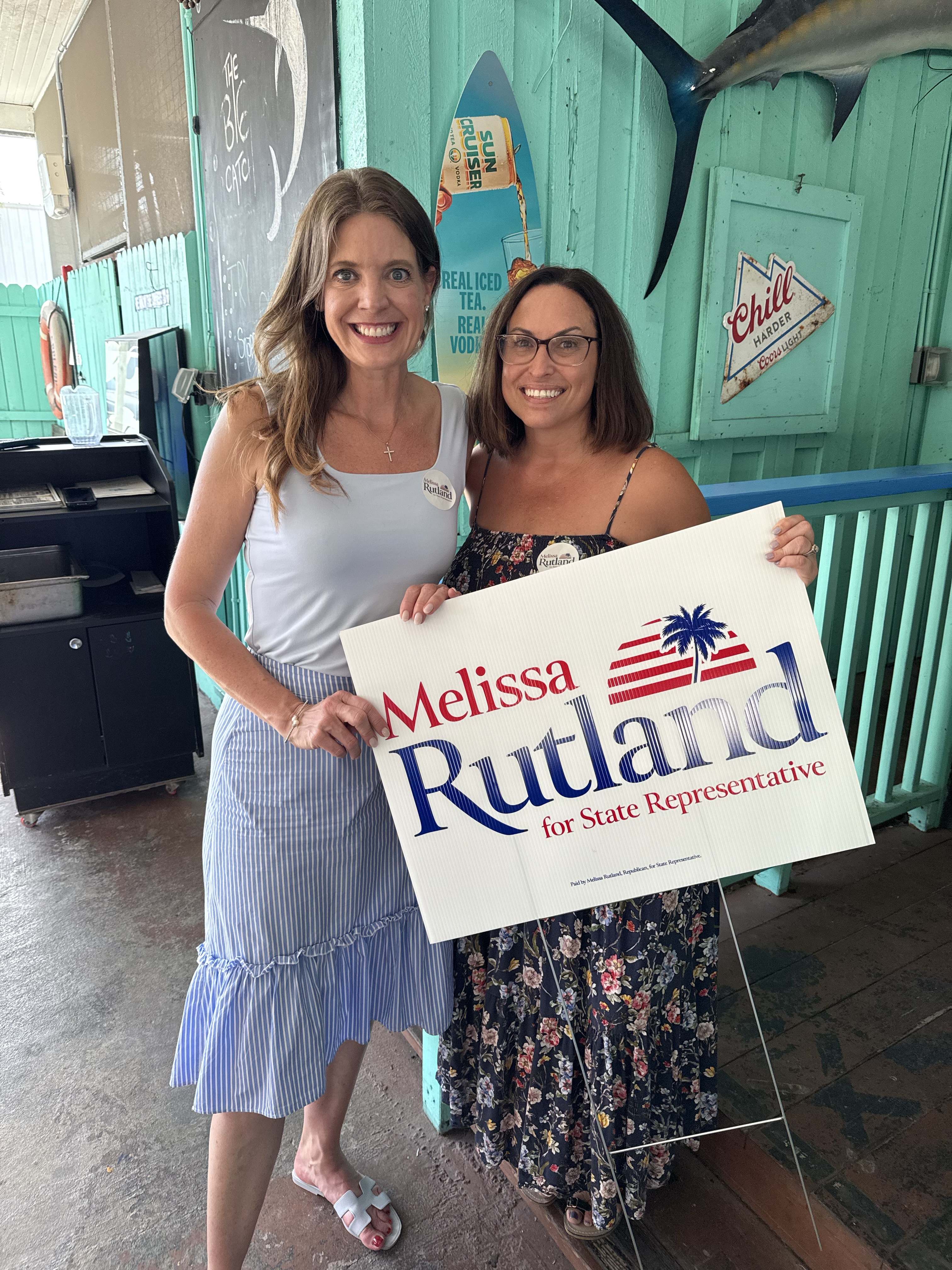 Melissa Rutland with yard sign